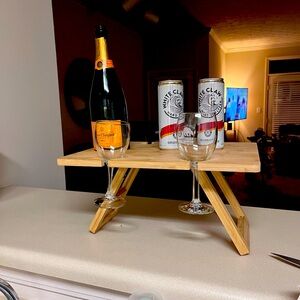 Wooden picnic table with wine holders